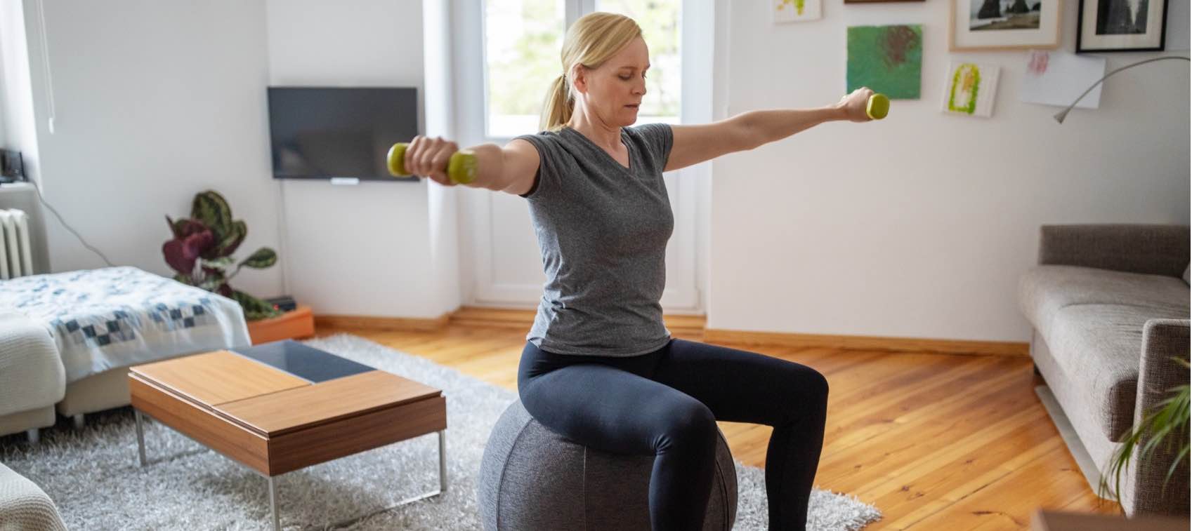 Premium Photo  Woman performs an exercise to strengthen the muscles of the  back and arms using a chair