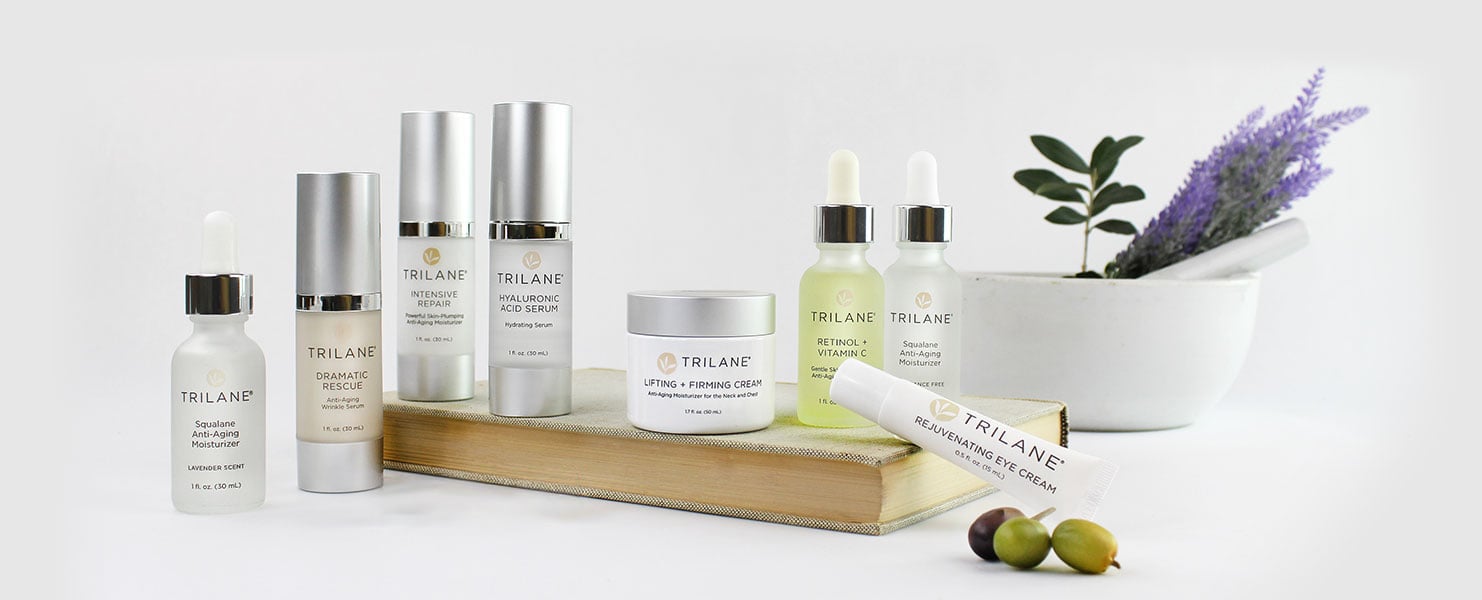 Trilane Skincare products with book and mortar pestle