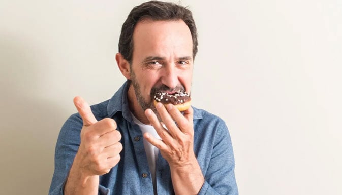 Man eating donut